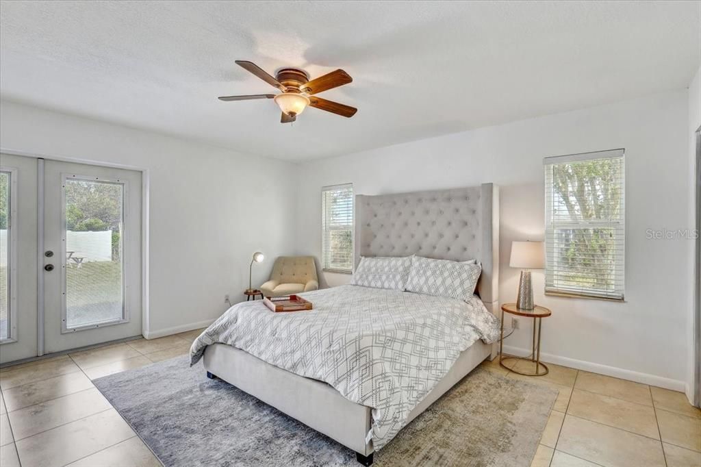 Primary suite (bedroom #6) with double door out to the pool