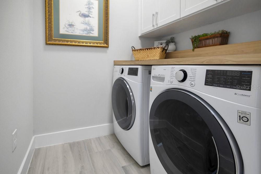 Laundry with custom cabinets