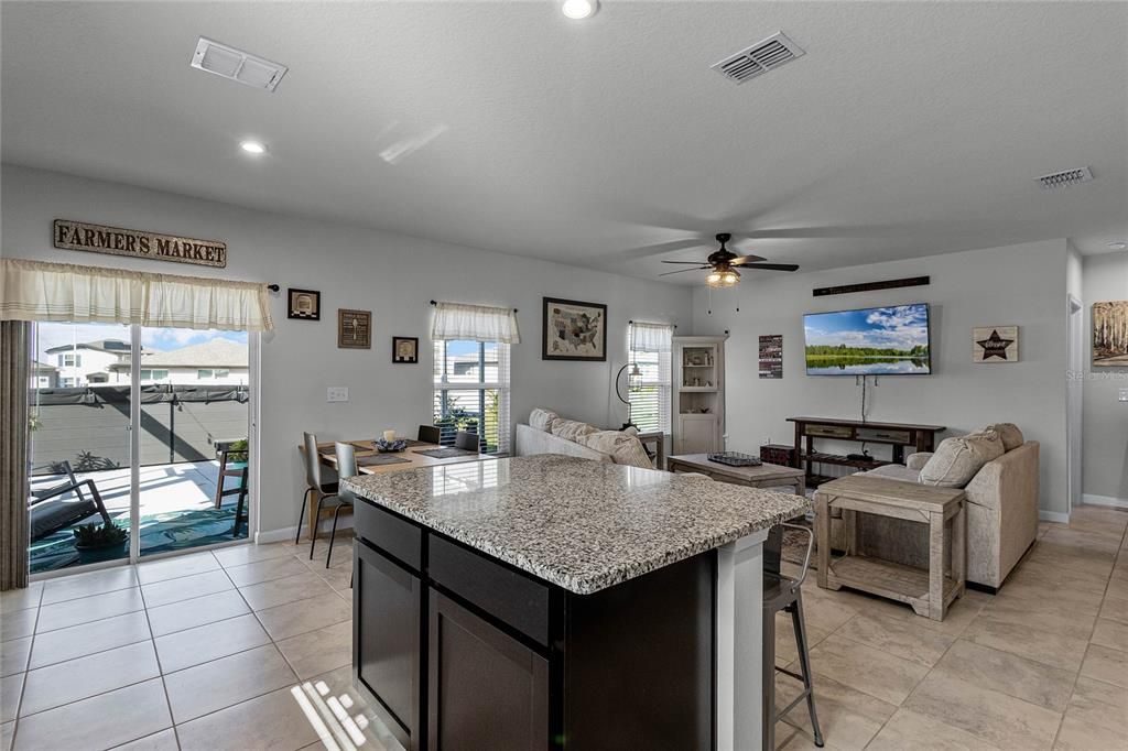 Kitchen overlooks Living and Dining Spaces