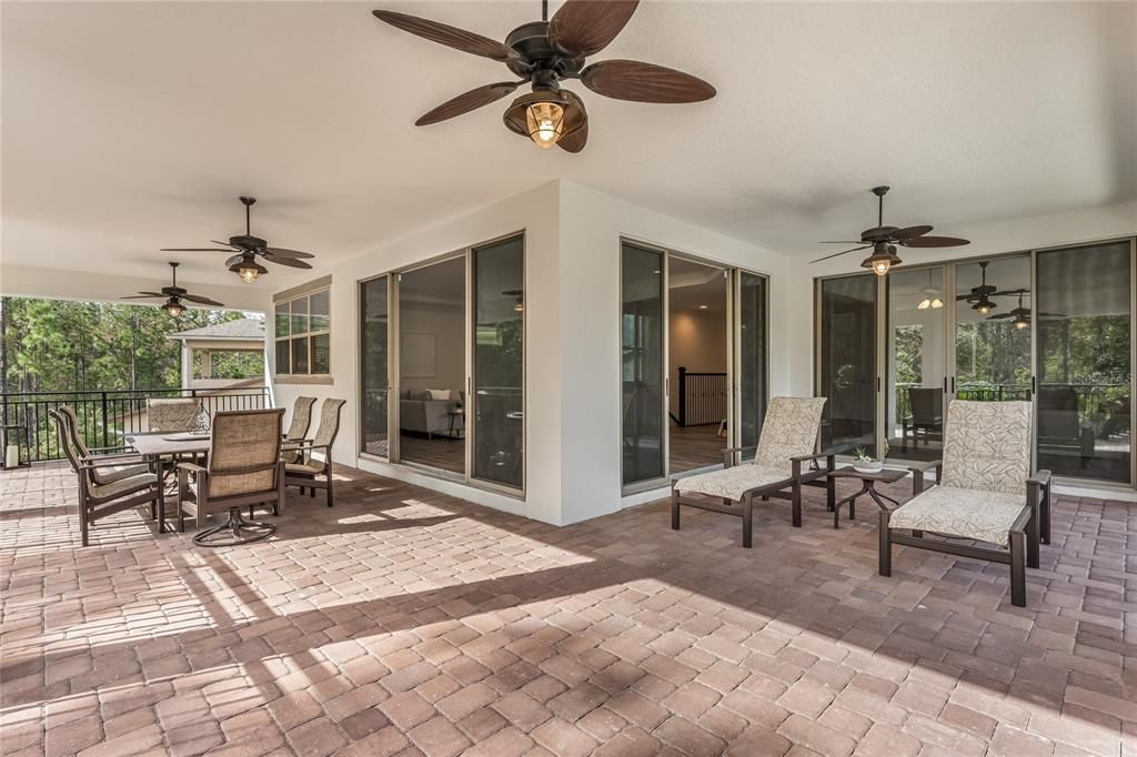 Upstairs Wrap-Around Balcony with 3 sets of sliding doors leading out. Pavered floors