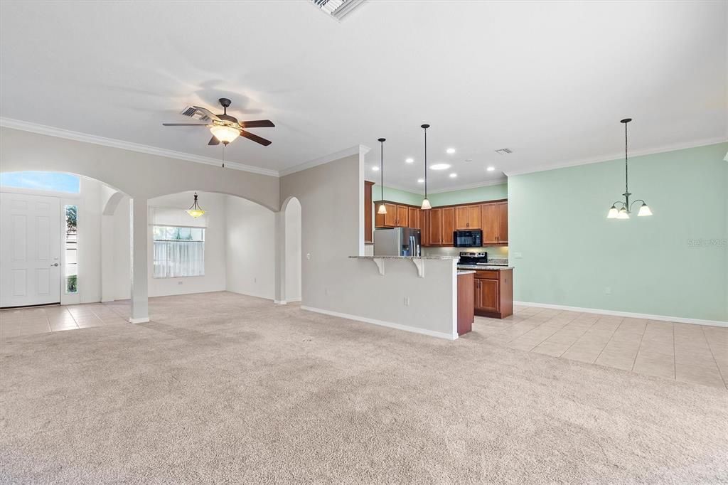 reverse look from living room towards kitchen and eat in dinette area