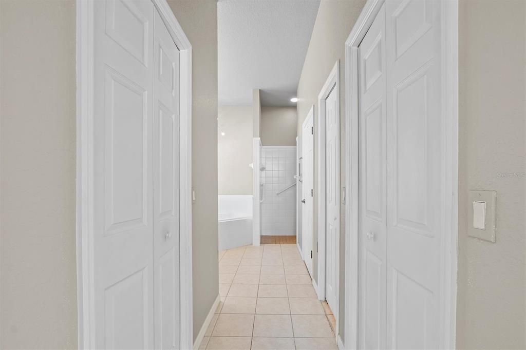 twin walk in closets going into Owner's Bath