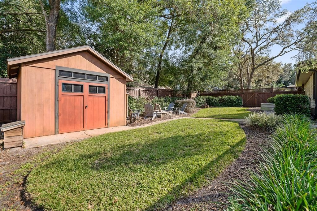 Large shed feauturing double door entry with loft inside for storage, and electricity.