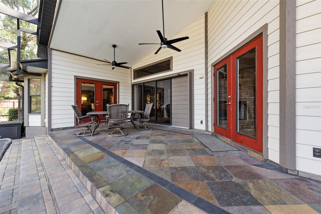 This huge magnificent lanai with slate flooring, ceiling fans french doors leading to this entertaing space.  This will be the owners place to retreat for coffee, grilling and entertaining.