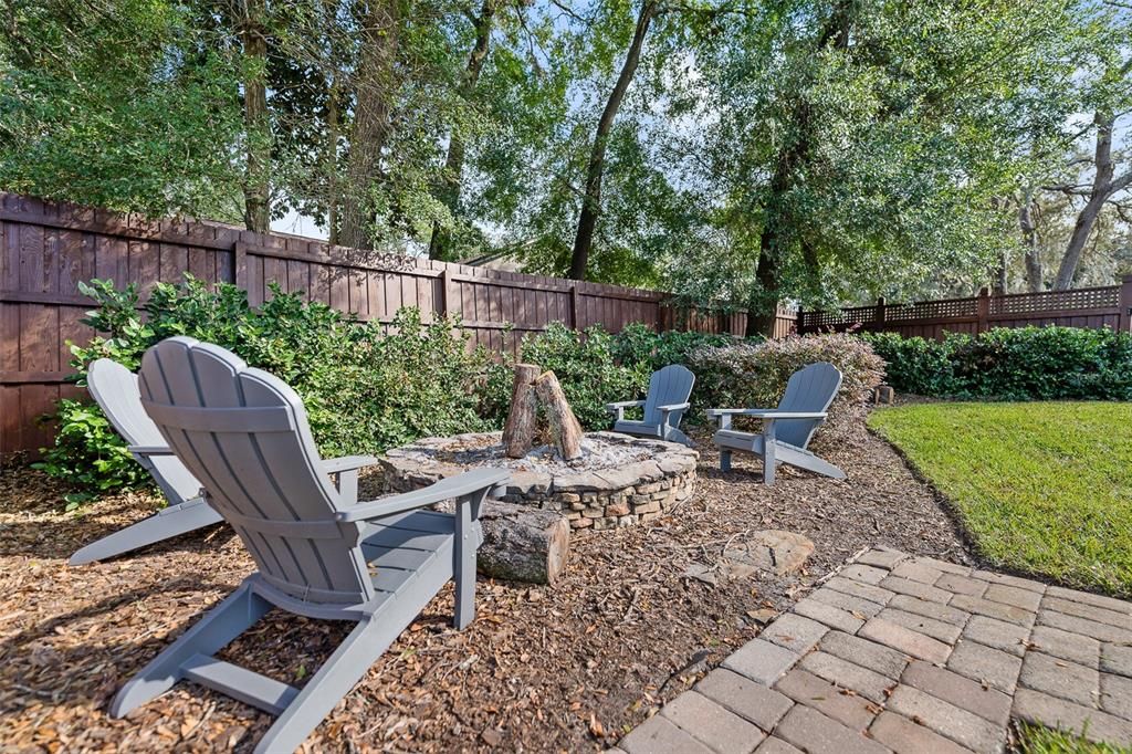 Outdoor fire pit , fully fenced backyard, meticulously maintained yard