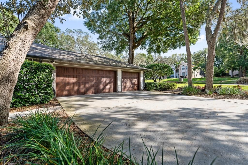 Side entry 3 car garage with garage with wood look insulated garage doors(2022)