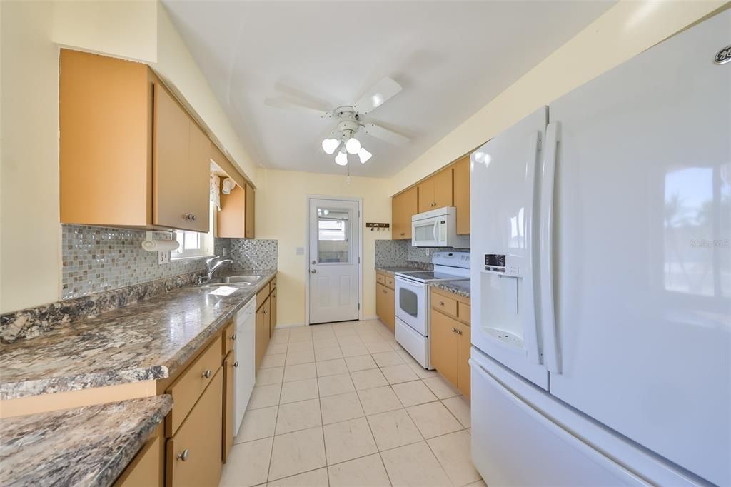 Kitchen with door to garage, great for groceries