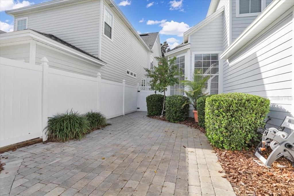 Back yard fenced and pavers