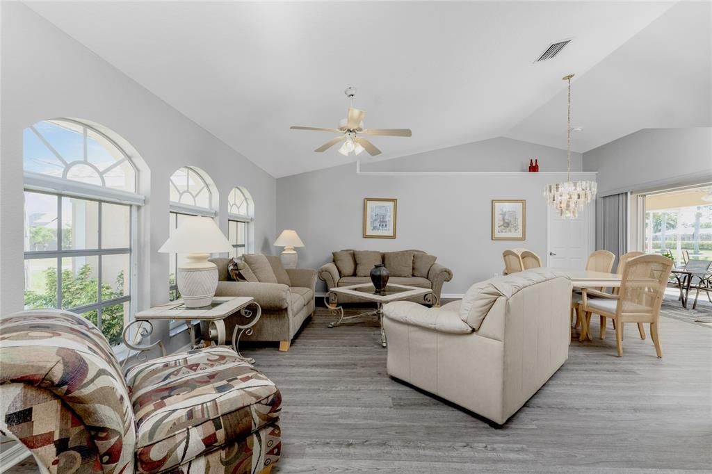 Large Living Room and Dining Table with Sliding Doors to Outside Pool Area