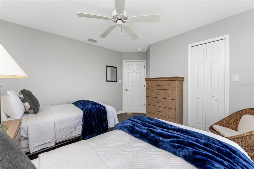 Bedroom 4 with Two Twin Beds and Big Window with Natural Light and Ceiling Fan