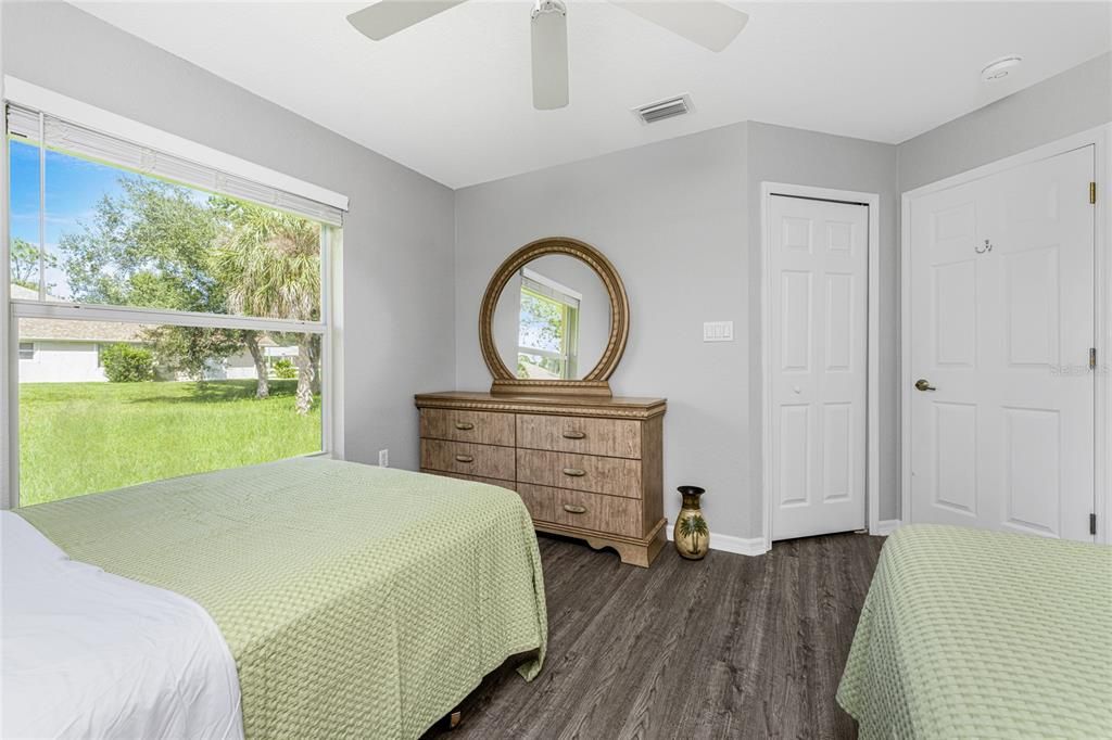 Bedroom 3 with Twin and Double Beds and Walk-in-Closet with Dresser and Mirror