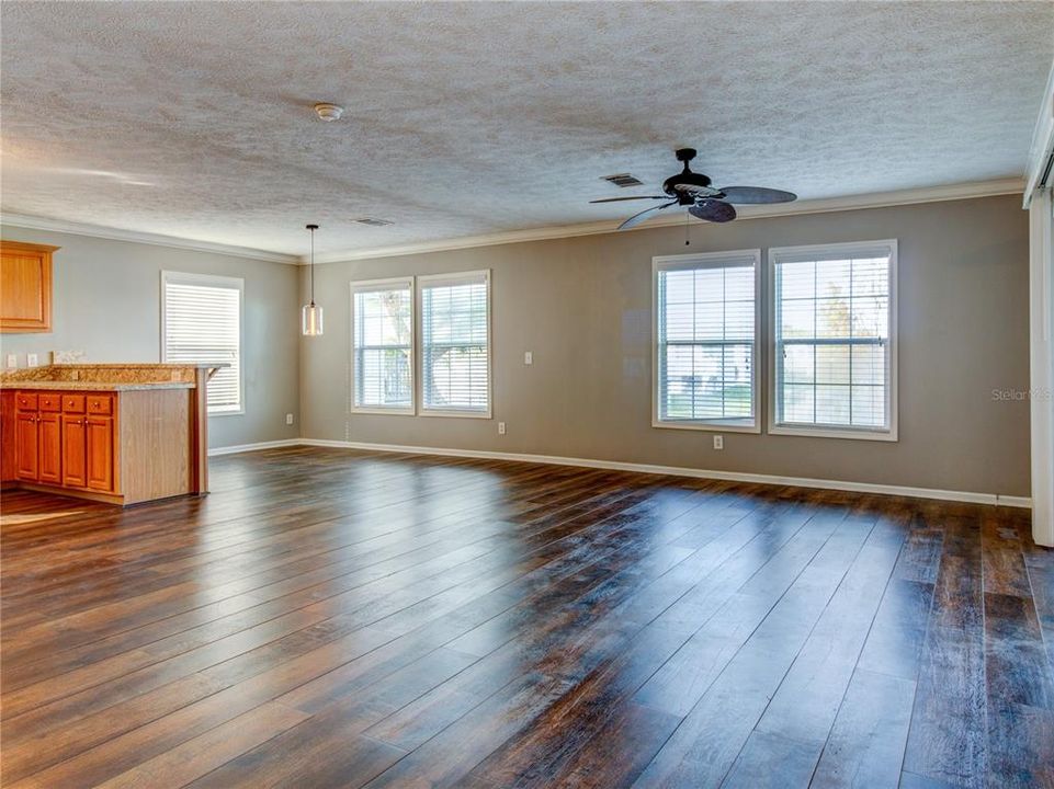 Dining Room view toward Living room and Back Enclosed/Covered/Screened Lanai at Lakefront