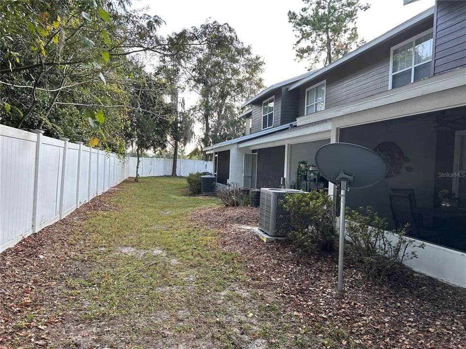 East-Facing Rear Lanai with door to semi-private yard off Living Room