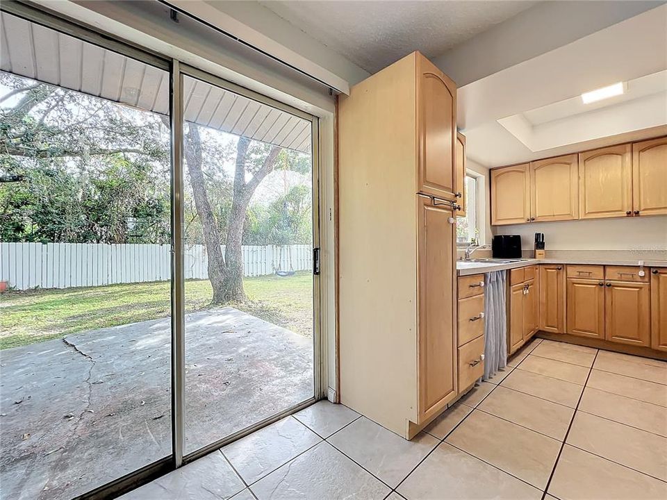 Sliding doors leading to fenced in back yard.