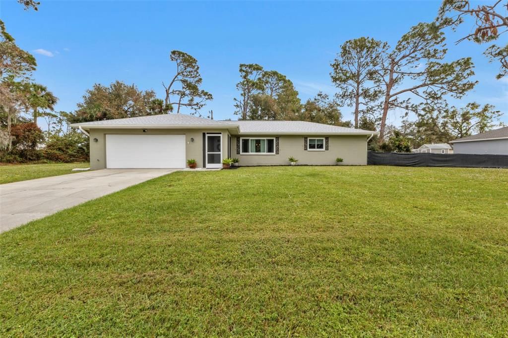 chain link fence all around interior of property with partial privacy screening for the front