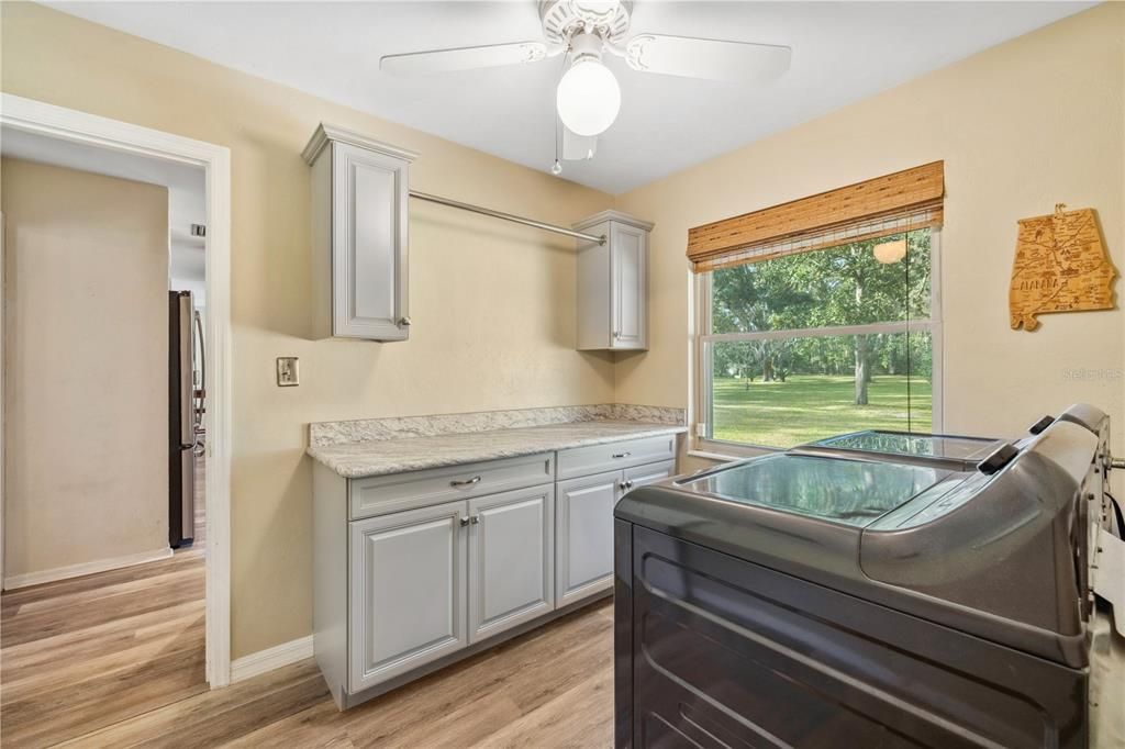 laundry room with new cabintry