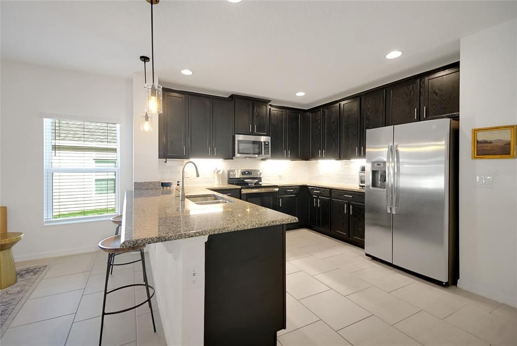 Nice deep kitchen with lots of cabinet and counter space