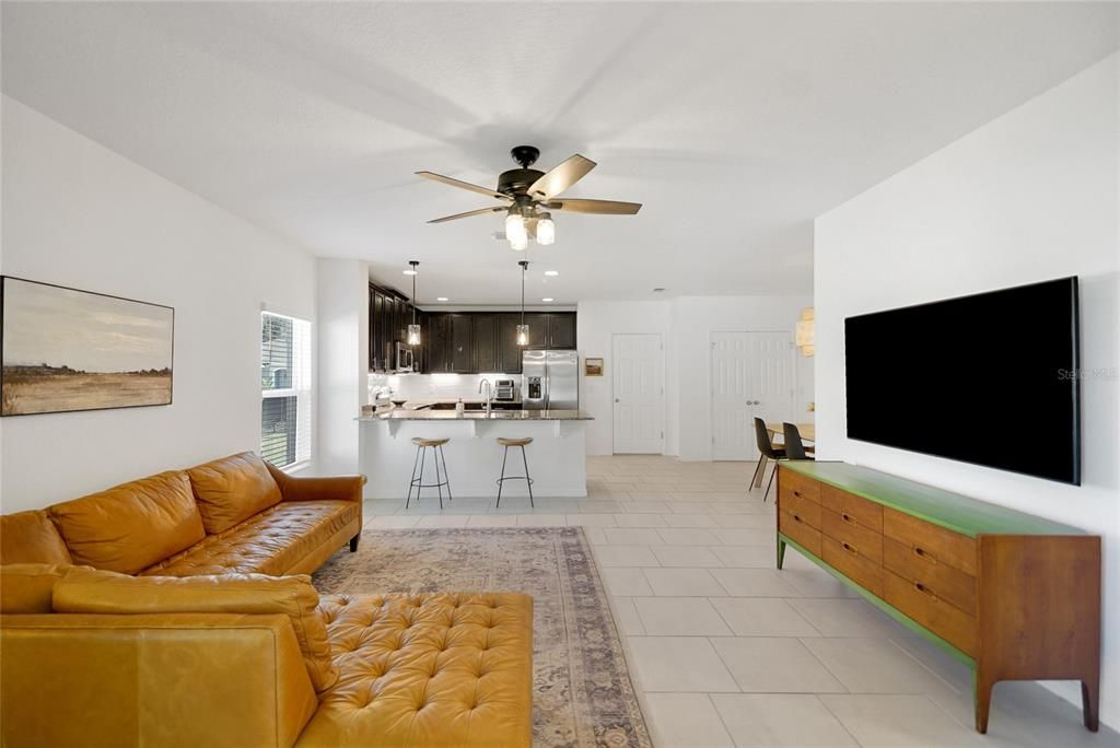 Living room, Breakfast Bar, Kitchen - door to garage and double doors to walk-in pantry