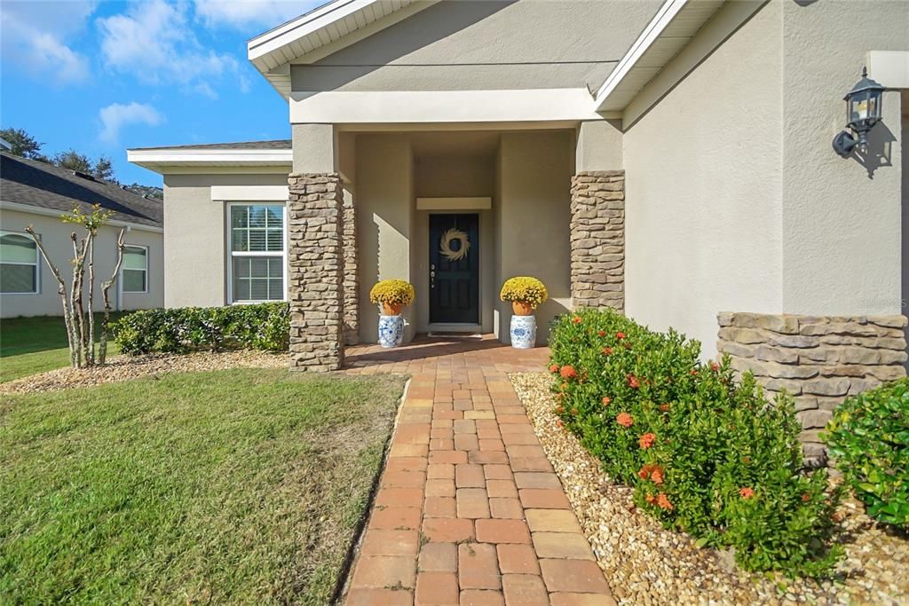 The stone and pavers add a touch of elegance to this amazing home!