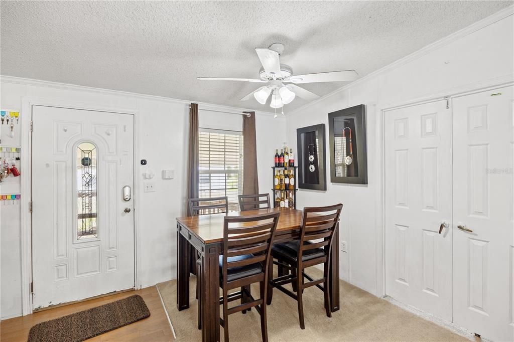 Dining area with double doors to den.