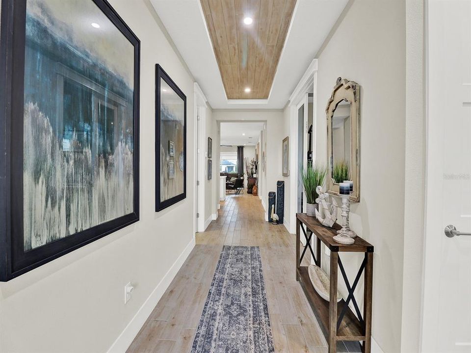 Beautiful foyer with custom wood ceiling