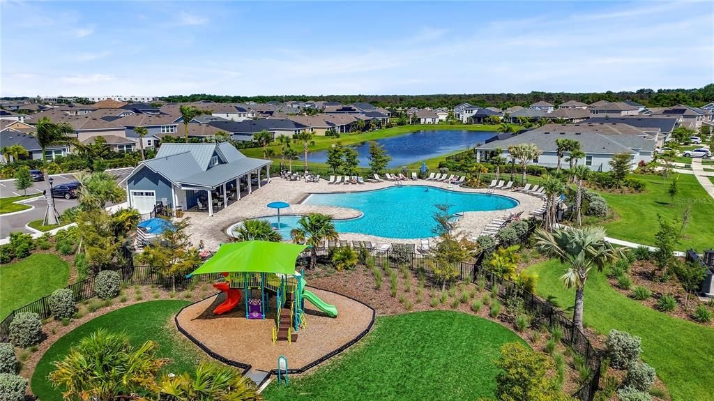 Community pool and playground on same street as house