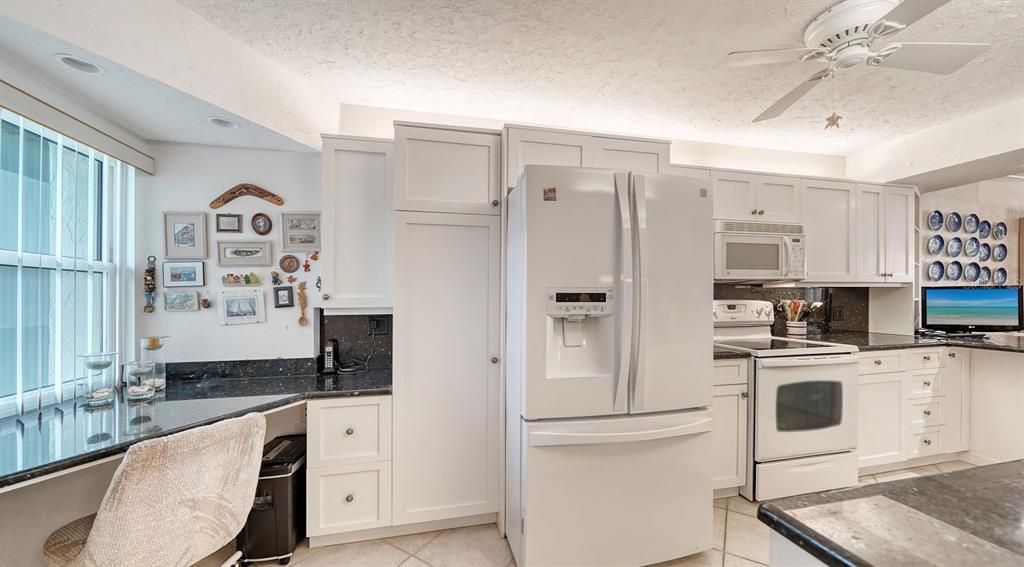 Built-in desk & plenty of storage cabinets.