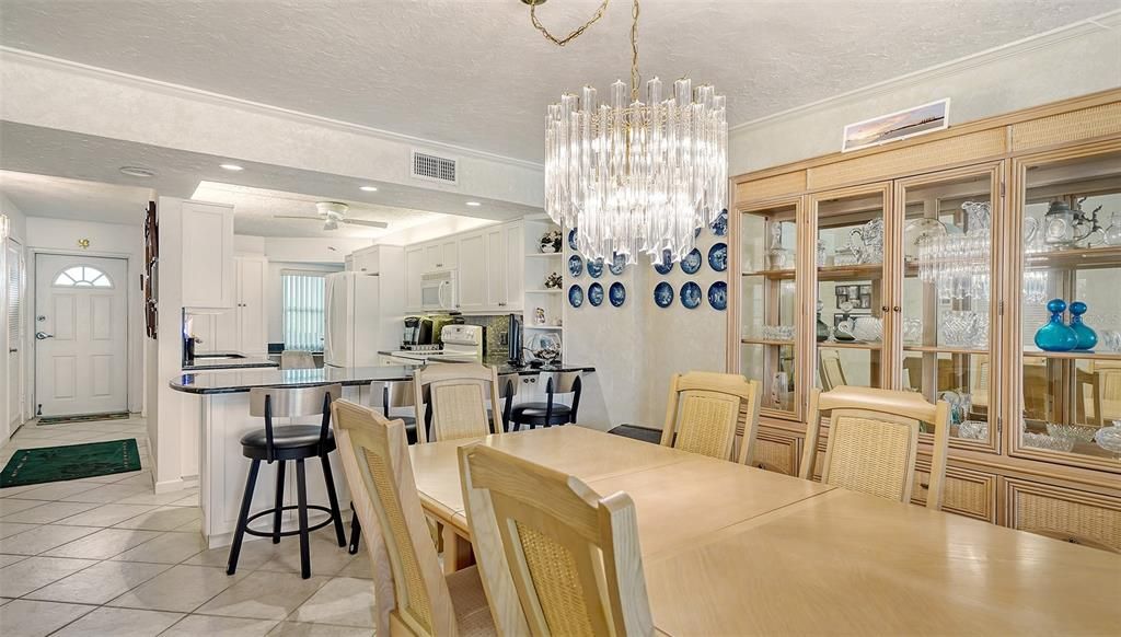 View of dining space and kitchen.