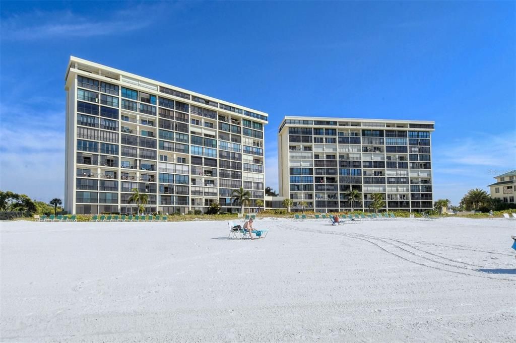 View of the Whispering Sands tower buildings from the beach.