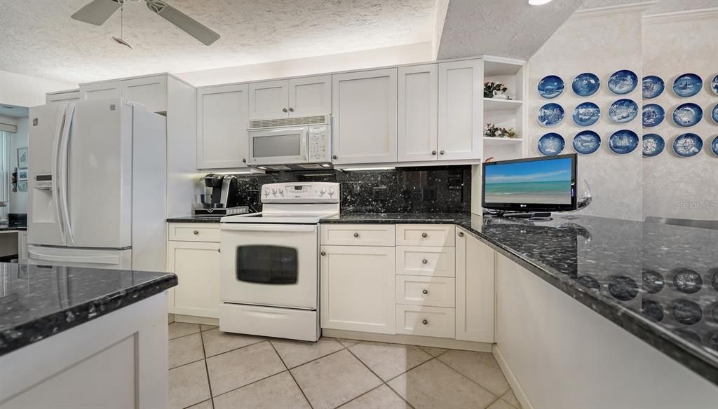 Granite countertops & backsplash.  Recessed LED overhead lighting.