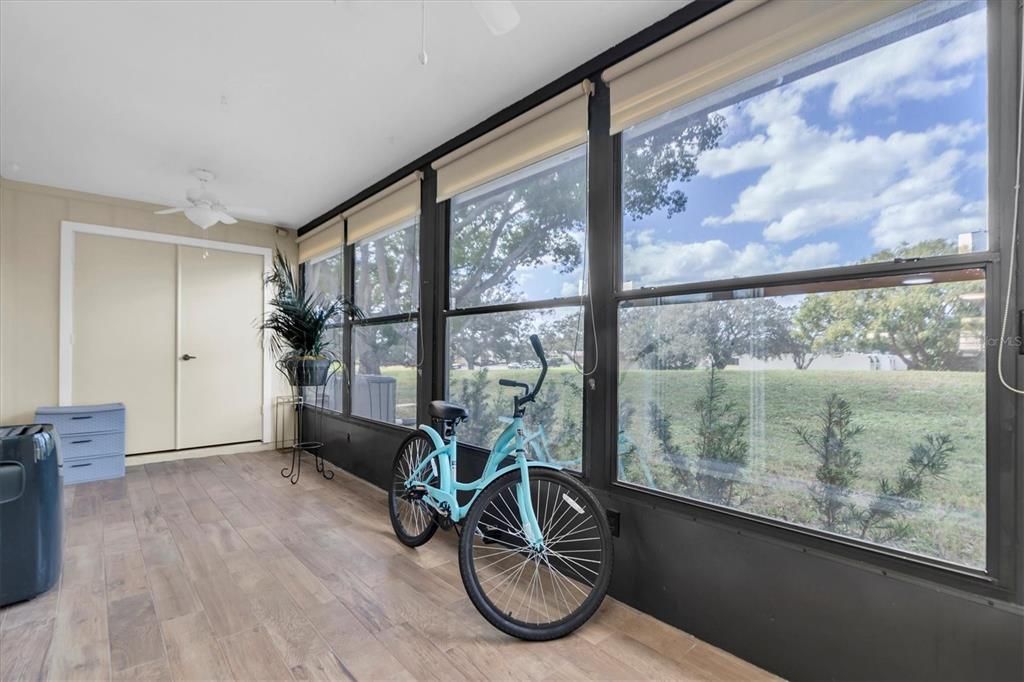 Tiled Florida Room with storage closet