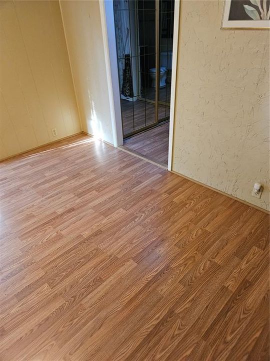 laminate flooring in the master bedroom and bathroom