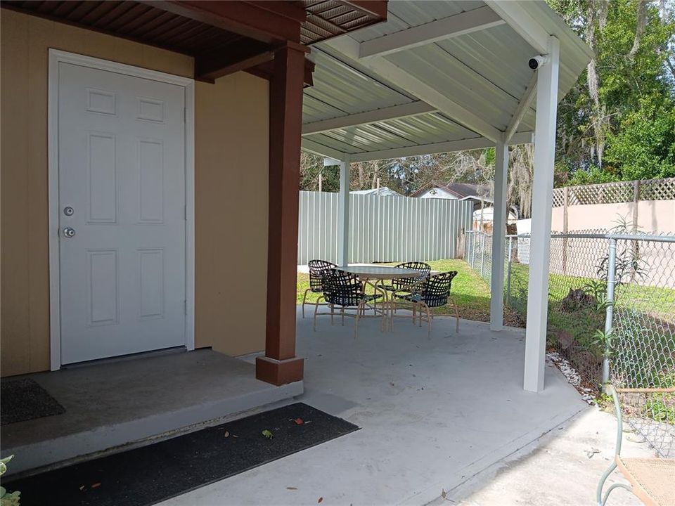 Concrete back deck with metal roof