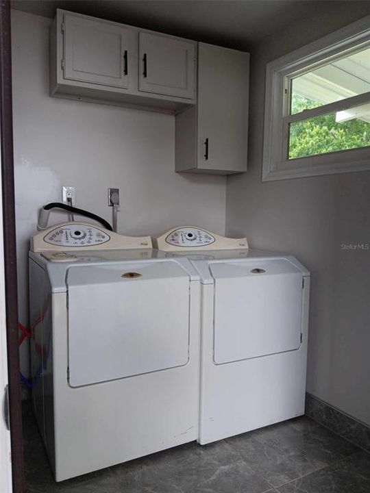 Utility room with washer and dryer