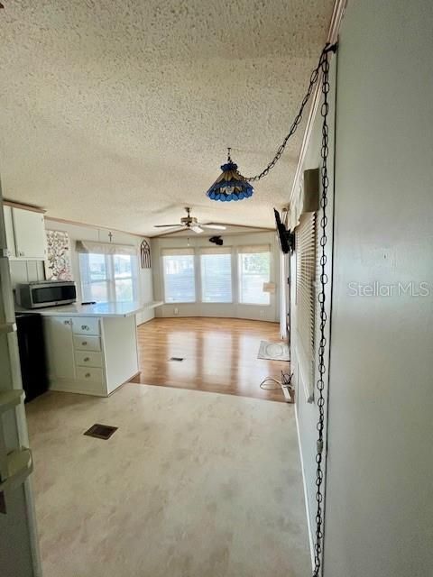 View from hallway to kitchen and living