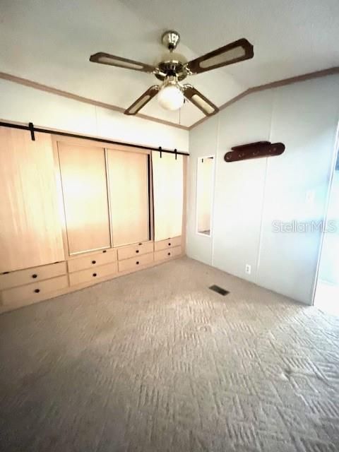 Bedroom with built-in closet and drawers