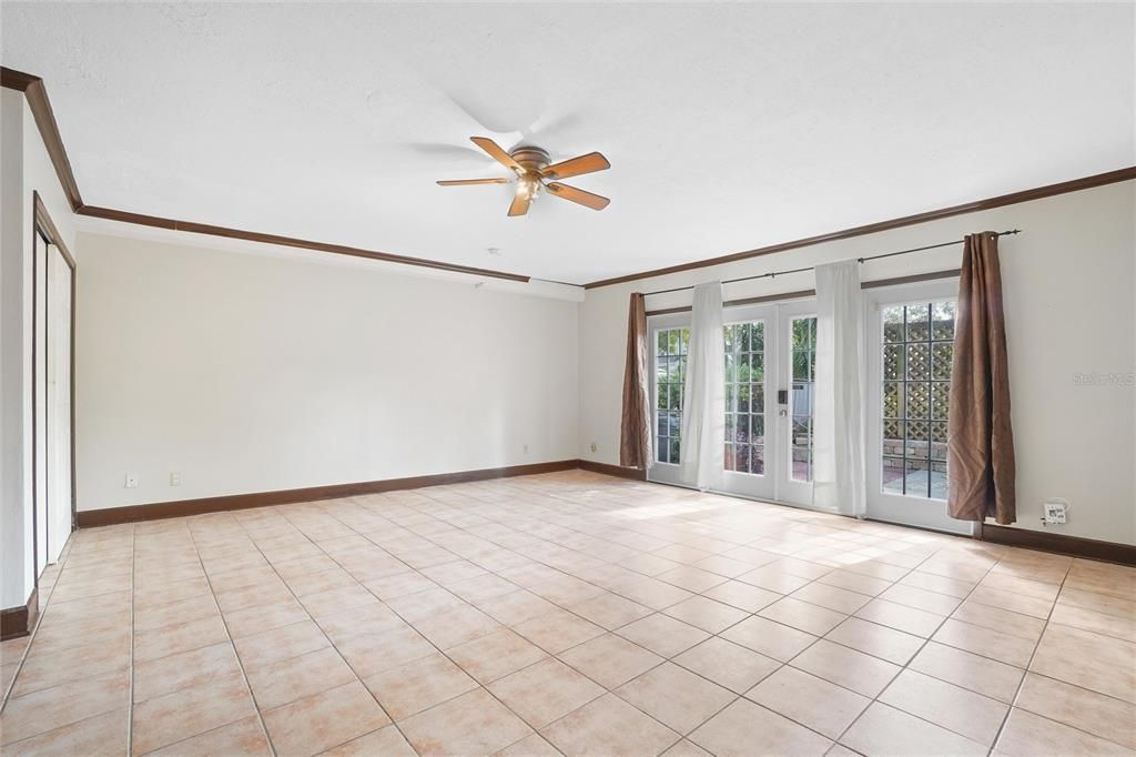 French doors lead to a quaint front porch