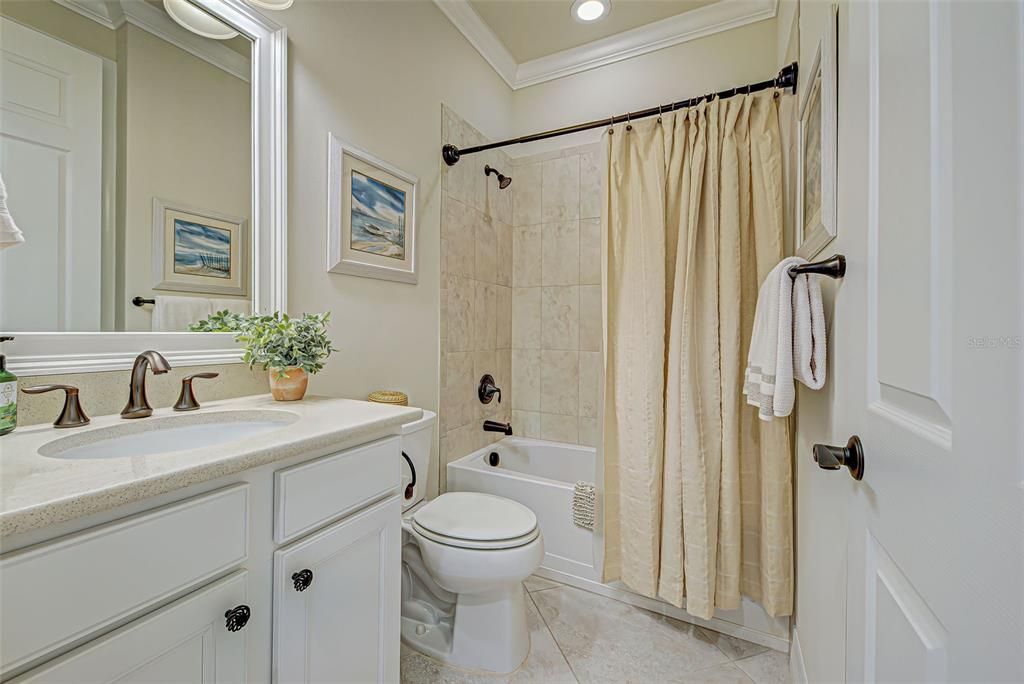 Guest bathroom with tub and shower