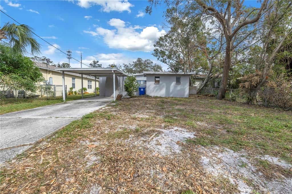 Backyard w/carport and driveway