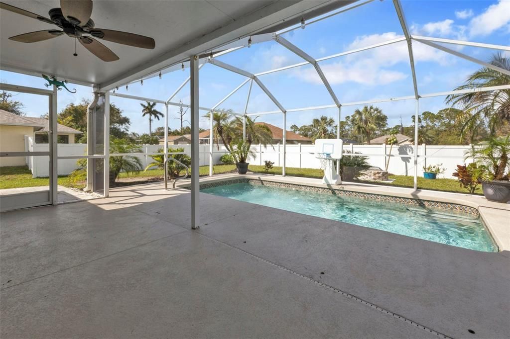 Pool features a child safety fence.