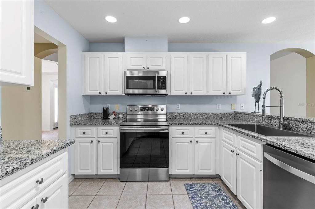 Kitchen with Granite counter tops, stainless steel appliances