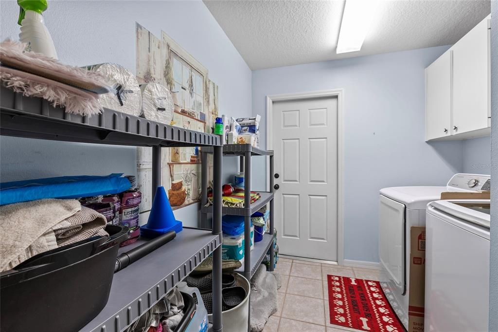 Inside laundry room, door straight ahead leads to 2 car garage