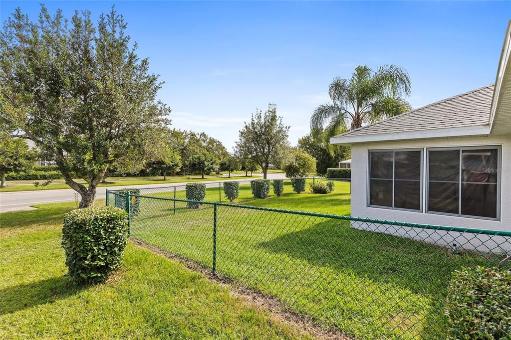 Fenced backyard with double gate for mowers