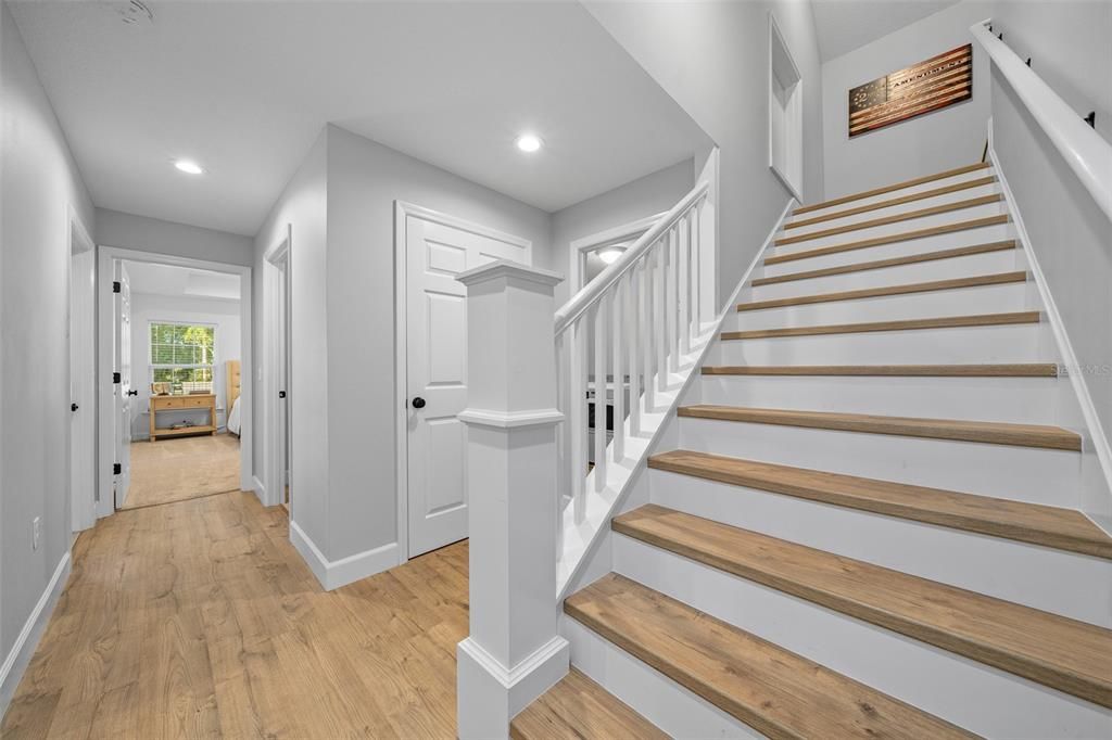 Stairs to bonus room and walk in attic storage