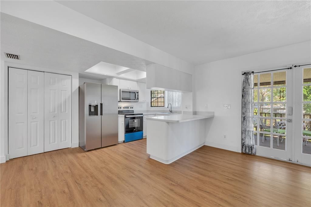 Spacious kitchen with breakfast bar and large pantry.