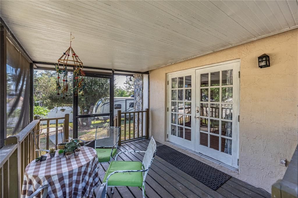 Back wood deck just outside the dining room is totally screened.