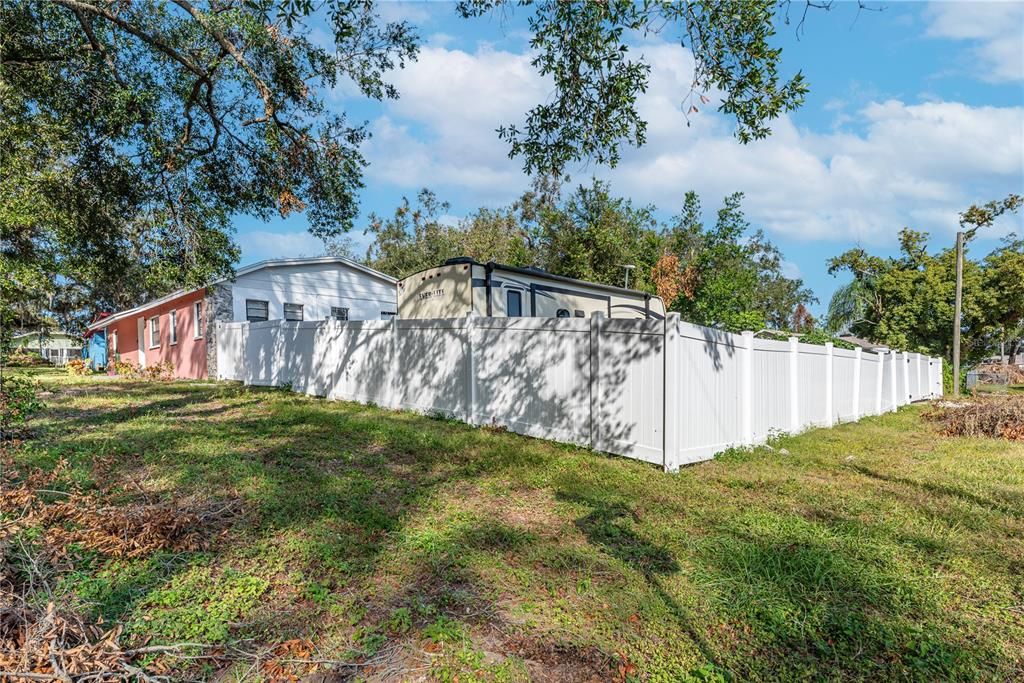 Lot is fenced with vinyl fence along front of property and wood fence on back property line.  Some of the wood fence was damaged during the recent storms and will be repaired before closing.