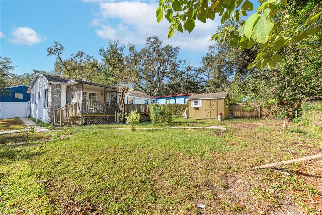 Back of home and detached shed with electric hookup.