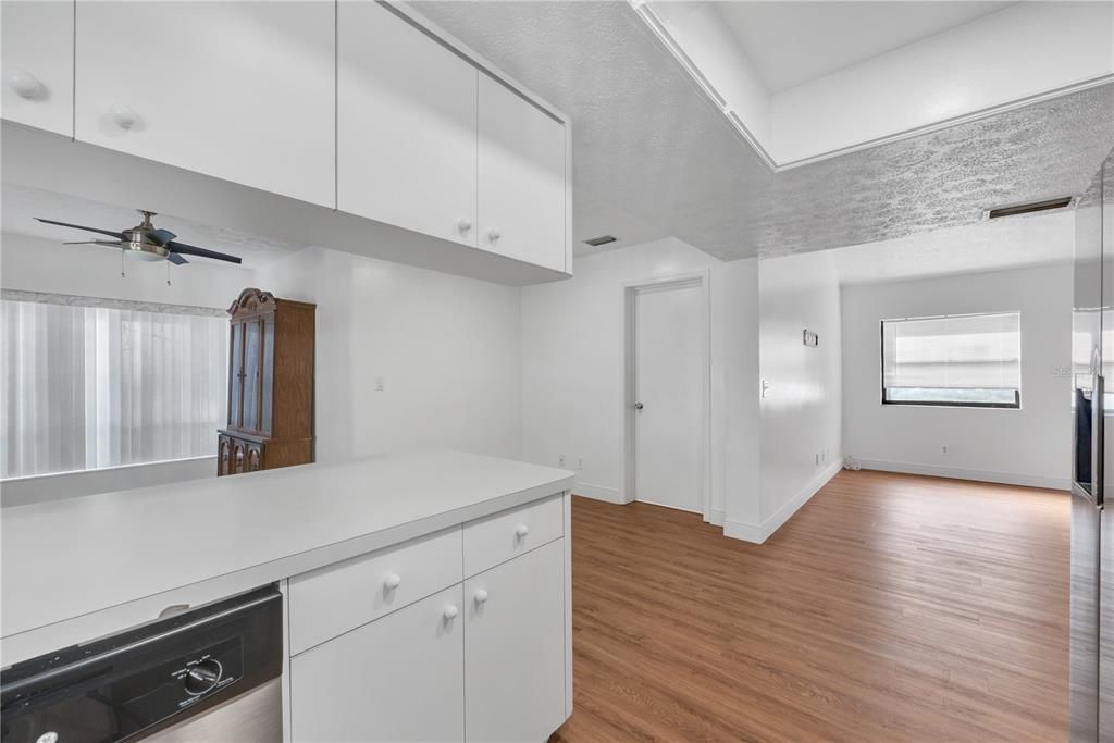 View of living room and dining room from kitchen sink.