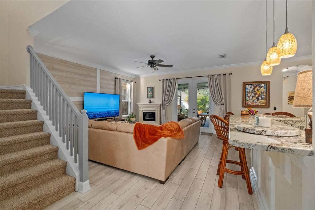 Tiled family room with Fireplace, French doors